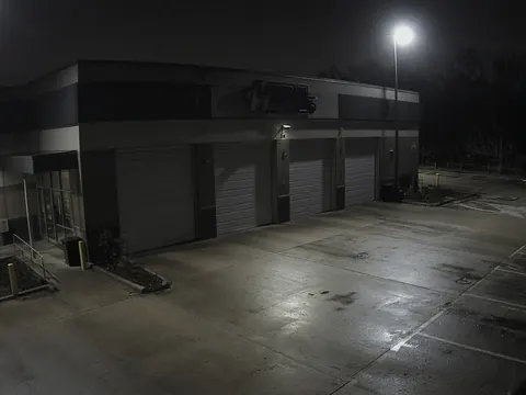Live video monitoring of an auto dealership service area for remote security camera monitoring