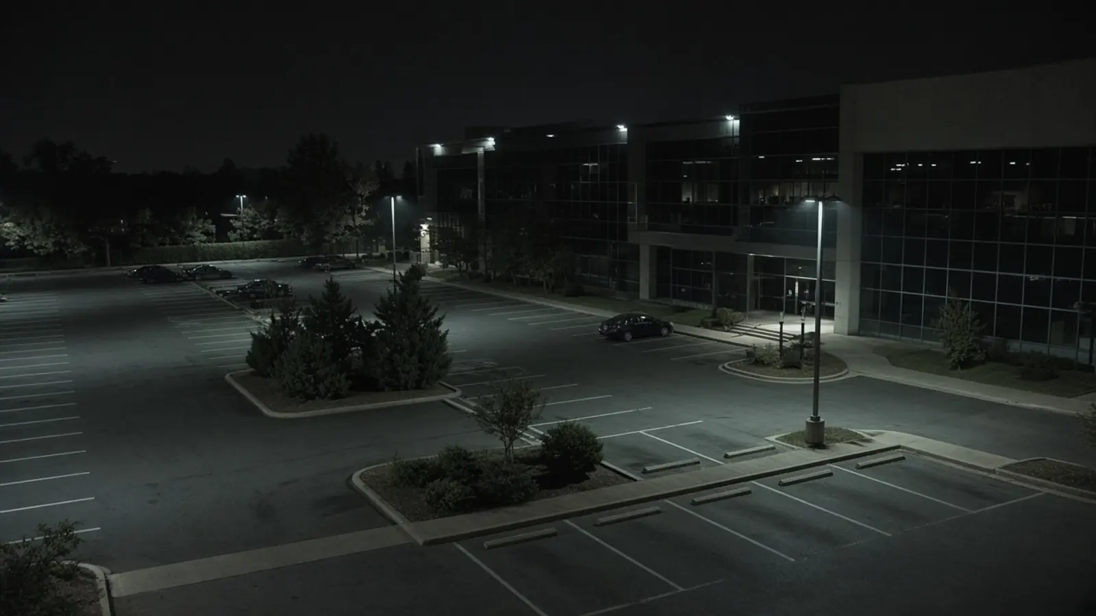 Commercial security camera monitoring CCTV view of a business property at night for remote video monitoring and live security camera monitoring