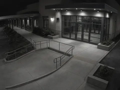 Facility security camera monitoring of a building loading entrance for remote video monitoring and live security camera monitoring