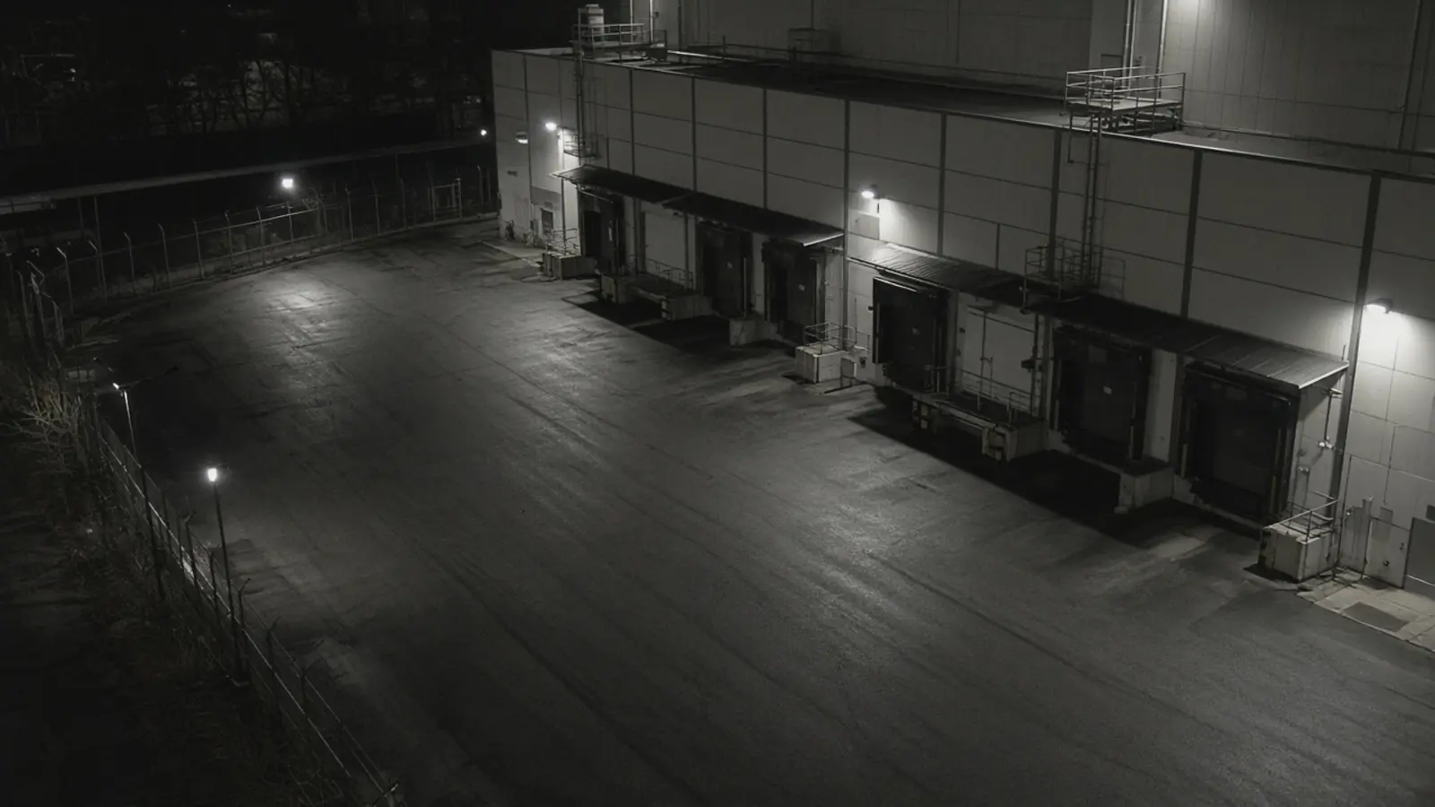 Industrial video monitoring CCTV view of a manufacturing facility at night for remote video monitoring and live security camera monitoring