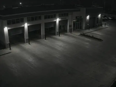 Live camera monitoring view of an after-hours equipment yard for live security camera monitoring